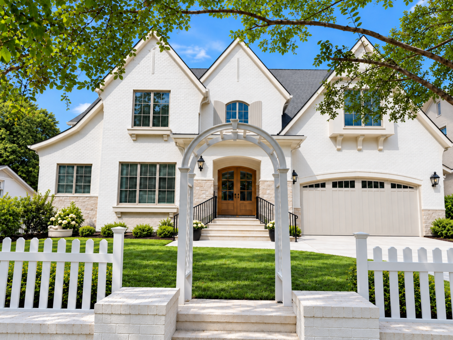 Elegant White Brick Home with Garden Arbor built by Everett Custom Homes