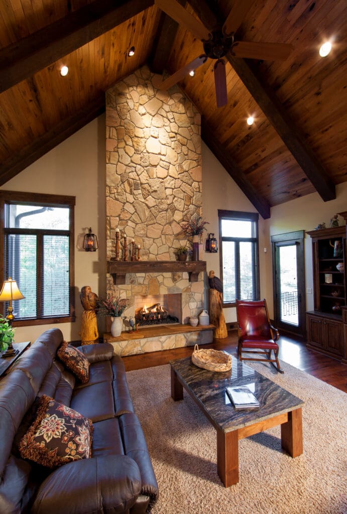 A living room with a fireplace and wood floors